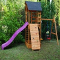 Tornyos fa kerti játszótér csúszdával, hintával, mászófallal